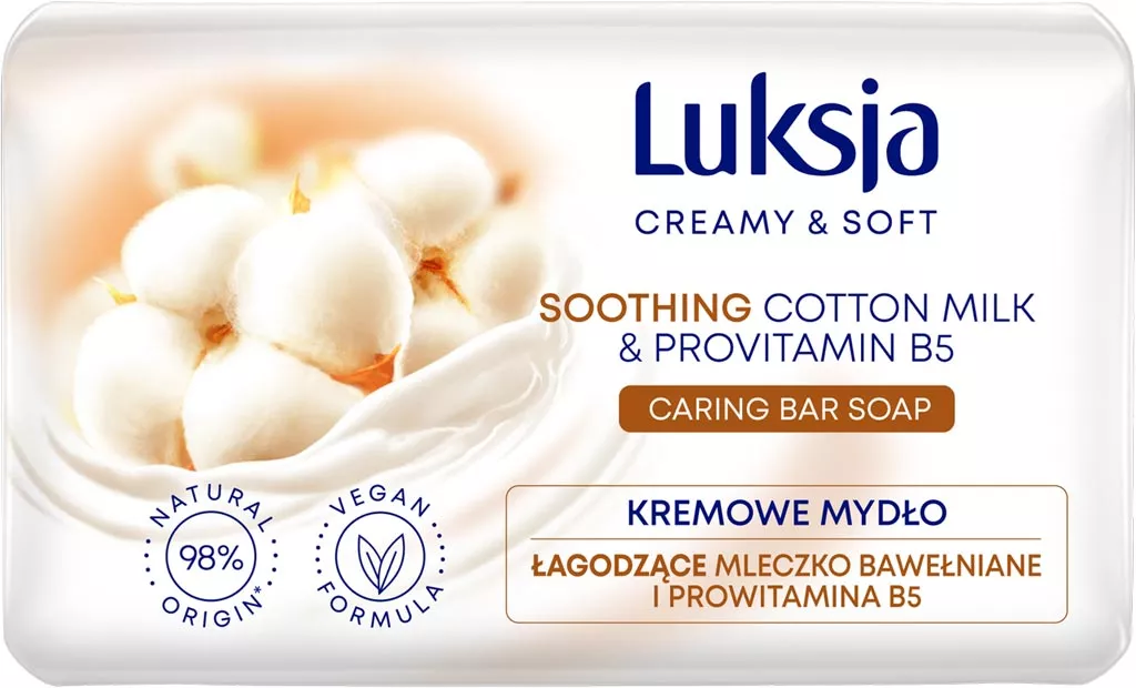 Opakowanie kremowego mydła w kostce Luksja o masie 90 g. Produkt zawiera łagodzące mleczko bawełniane i prowitaminę B5, jest wegański i ma 98% składników pochodzenia naturalnego.