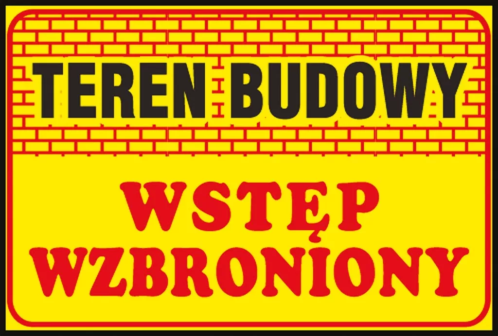 Żółta tablica ostrzegawcza z napisem 