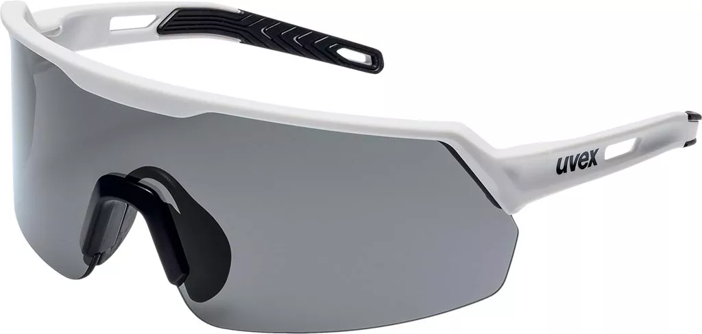 Okulary ochronne UVEX ULTRASHIELD z przyciemnianymi szkłami, oprawa biała, zabezpieczają przed odpryskami i promieniowaniem UV. Model sportowy, lekki, z regulowanym noskiem.