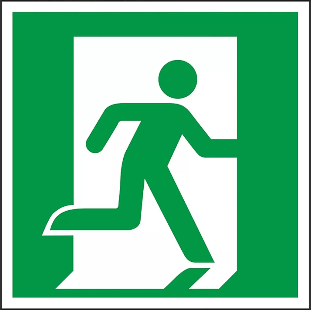 Znak bezpieczeństwa przedstawiający symbol biegnącej osoby w kierunku wyjścia, otoczonego zielonym tłem i białą ramką.