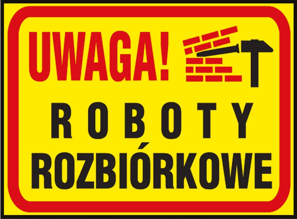 Tablica ostrzegawcza jest żółta z czerwoną ramką. Na górze napis 