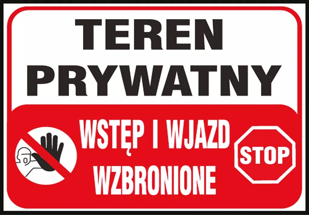 Tablica ostrzegawcza w kolorze białym z czerwonym obramowaniem, zawiera napis „TEREN PRYWATNY WSTĘP I WJAZD WZBRONIONE” z grafiką dłoni i znakiem „STOP”.