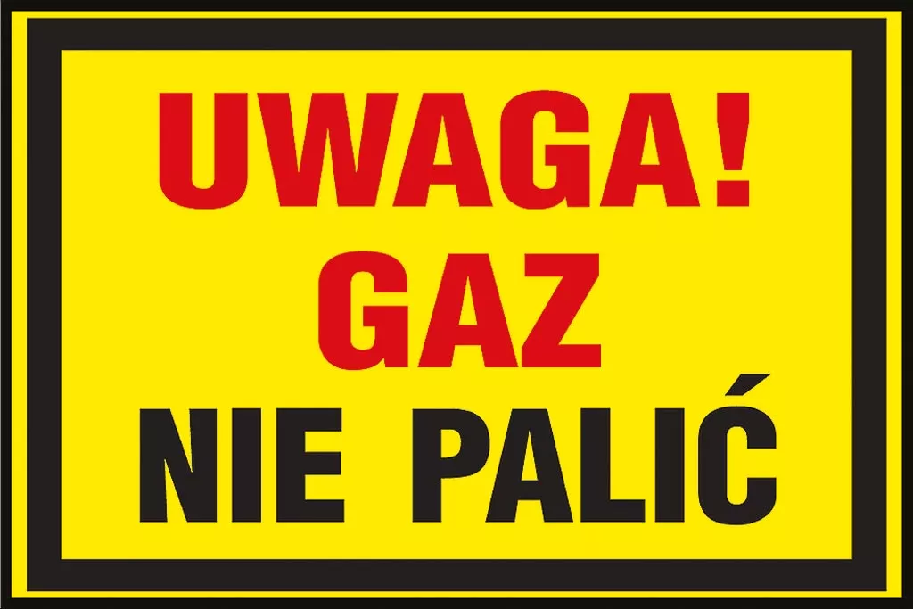 Znak ostrzegawczy w kolorze żółtym z napisem 