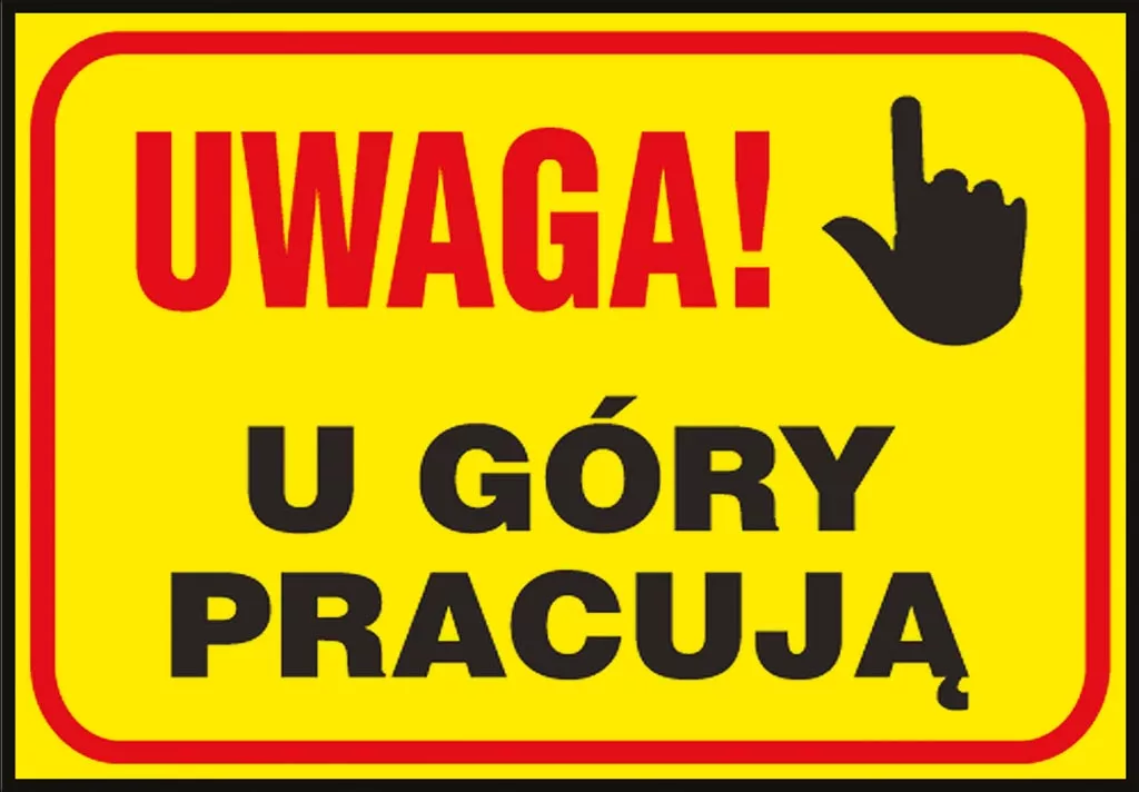 Tablica ostrzegawcza w kolorze żółtym z czerwoną obwódką i czarnymi napisami. Na górze napis 
