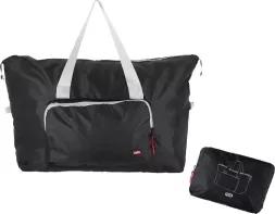 Torba podróżna składana BAG o pojemności 16 litrów, zewnętrzna kieszeń zapinana na zamek, wykonana z czarnego materiału, z jasnymi uchwytami. Po złożeniu zajmuje niewiele miejsca.