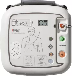 Defibrylator AED iPAD SP1 wyposażony w przyciski funkcyjne, wskaźniki stanu i ilustracyjne instrukcje użycia. Posiada również wbudowany głośnik i uchwyt do przenoszenia.
