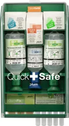 Stacja pierwszej pomocy QuickSafe® Complete zawiera różne opatrunki, plastry, zimny spray oraz środki do czyszczenia oczu i oparzeń, umieszczone w wyraźnie oznakowanych pojemnikach dla łatwej identyfikacji.