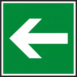 Znak ewakuacyjny na zielonym tle, z białą strzałką skierowaną w lewo, wskazujący kierunek drogi ewakuacyjnej.